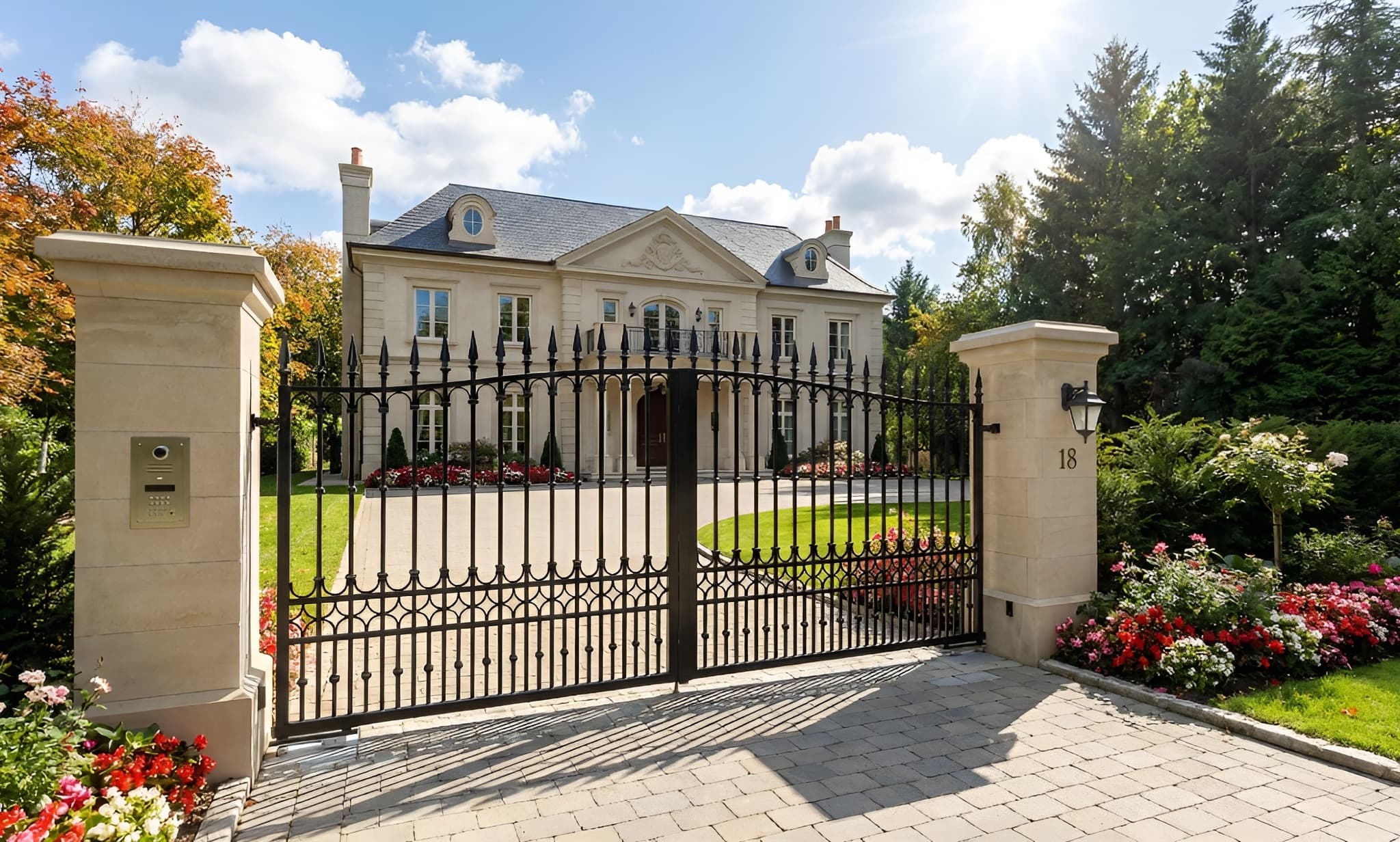 Luxury mansion with a gated entrance and well-maintained garden